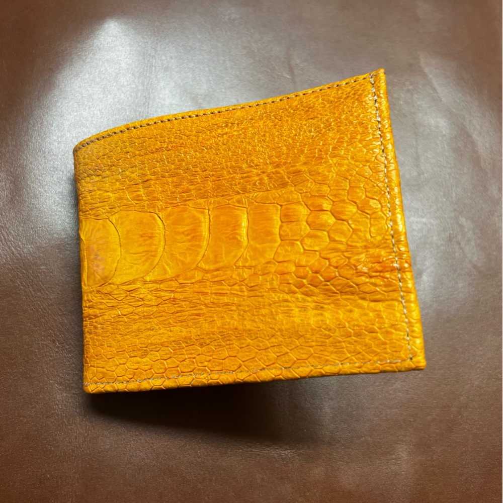 Mens wallet in orange ostrich leather.